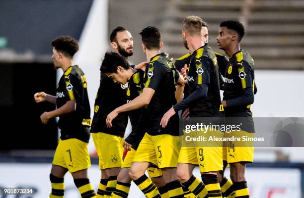 Alexander Isak of Borussia Dortmund celebrates scoring the opening goal with his team mates during the friendly match between Borussia Dortmund and...