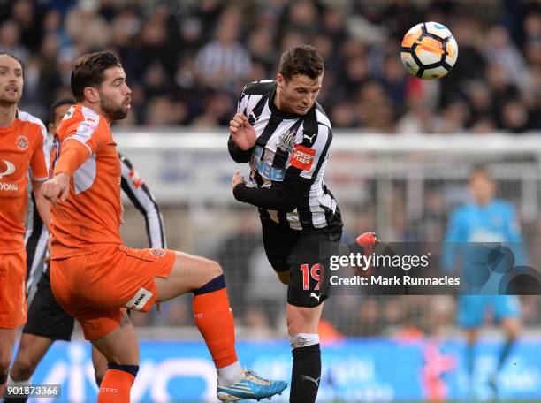 Javier Manquillo of Newcastle United is challenges by Elliot Lee of Luton Town during the Emirates FA Cup Third Round match between Newcastle United...