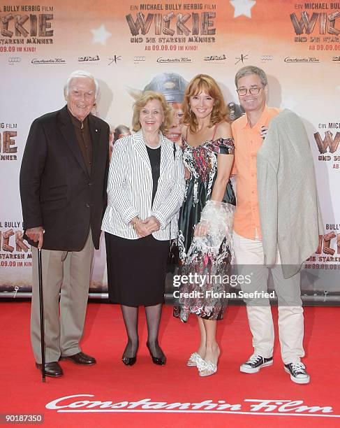 Actor Hans-Joachim 'Blacky' Fuchsberger and wife Gundel Fuchsberger and son Thomas Fuchsberger and wife Cornelia Corba attend the premiere of 'Vicky...