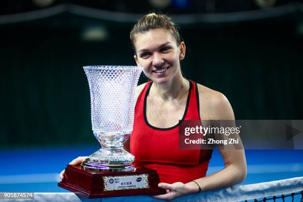 Simona Halep of Romania celebrates with trophy after winning the final match against Katerina Siniakova of Czech Republic during Day 7 of 2018 WTA...