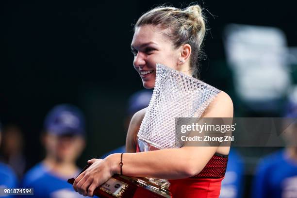 Simona Halep of Romania celebrates with trophy after winning the final match against Katerina Siniakova of Czech Republic during Day 7 of 2018 WTA...