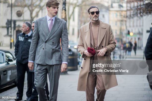 Toby Huntington-Whiteley and Richard Biedul wearing beige wool coat, suit, sunglasses during London Fashion Week Men's January 2018 on January 6,...
