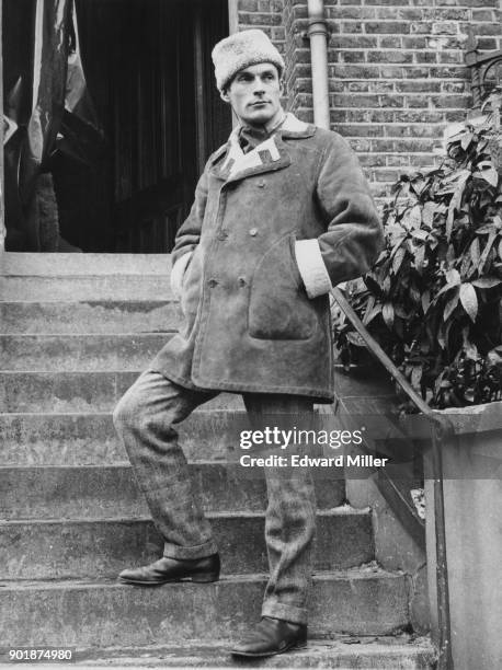 British film producer Michael Birkett, 2nd Baron Birkett on the steps of a derelict house in Hackney, London, where the Harold Pinter play 'The...