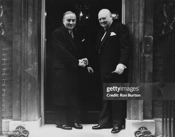 British Prime Minister Winston Churchill says goodbye to French Foreign Minister Georges Bidault after inviting him to lunch at 10 Downing Street in...