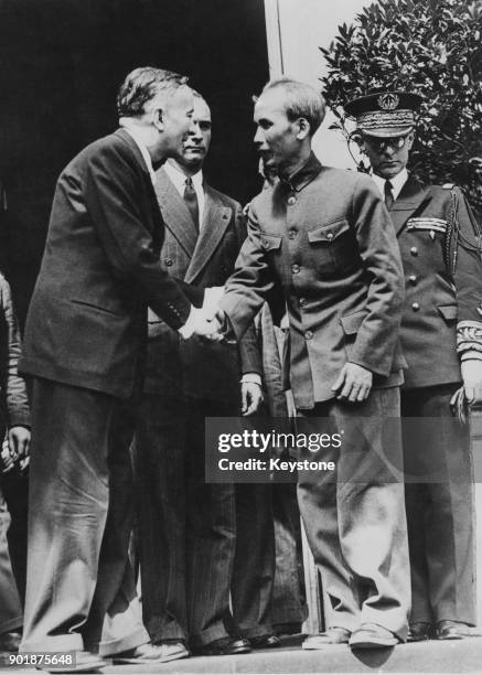 French politician Georges Bidault shakes hands with Ho Chi Minh , President of the Democratic Republic of Vietnam, in Paris, France, 4th July 1946....