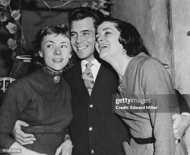 English actor Dirk Bogarde poses with actresses Geraldine McEwan and Vivienne Drummond , his co-stars in the show 'Summertime' at the Apollo Theatre...