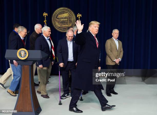 President Donald Trump waves as he departs after addressing the media at Camp David on January 6, 2018 in Thurmont, Maryland. President Trump met...