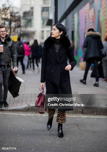 Caroline Issa wearing wool coat during London Fashion Week Men's January 2018 on January 6, 2018 in London, England.