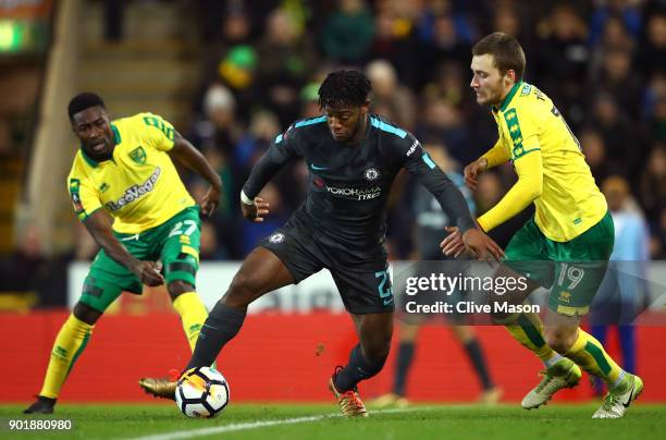 Michy Batshuayi of Chelsea is closed down by Alexander Tettey and Tom Trybull of Norwich City during The Emirates FA Cup Third Round match between...