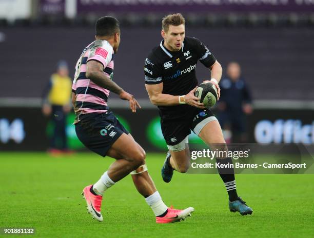 Ospreys' Dan Biggar under pressure from Cardiff Blues Rey Lee-Lo during the Guinness Pro14 Round 13 match between Ospreys and Cardiff Blues at...