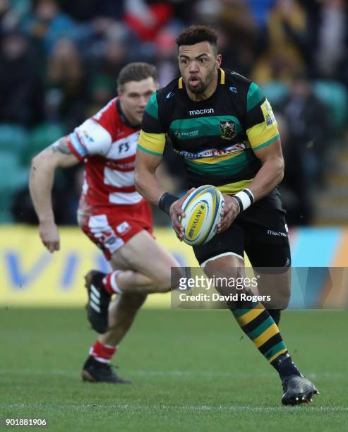 Luther Burrell of Northampton breaks with the ball during the Aviva Premiership match between Northampton Saints and Gloucester Rugby at Franklin's...