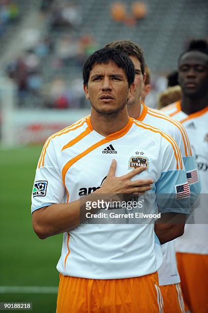 Brian Ching of the Houston Dynamo stands for the national anthem prior to the game against the Colorado Rapids on August 30, 2009 at Dicks Sporting...