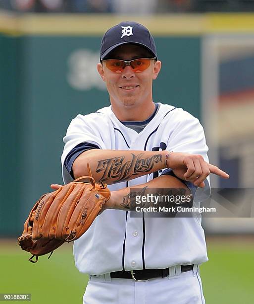 Brandon Inge of the Detroit Tigers shows off his new tattoos before the game against the Tampa Bay Rays at Comerica Park on August 30, 2009 in...