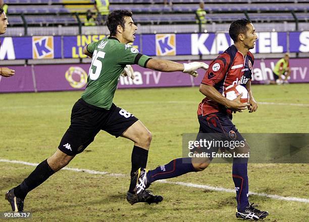 Goalkeeper Gianluca Curci of Cagliari runs after Neves Capucho Jeda of Cagliari after he had scored from the penalty spot during the Serie A match...