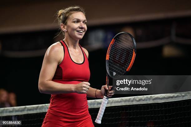 Simona Halep of Romania celebrates after winning the 2018 WTA Shenzhen Open single finals at Longgang International Tennis Center on January 6, 2018...