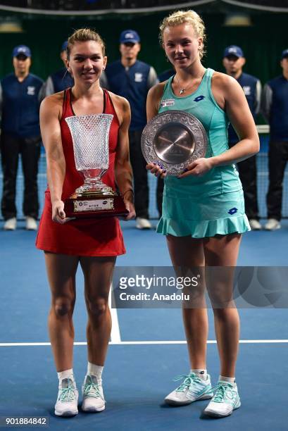 Simona Halep of Romania poses with her trophy after winning the 2018 WTA Shenzhen Open single finals against Katerina Siniakova of Czech Republic at...