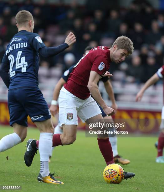 Sam Foley of Northampton Town attempts to control the ball under pressure from Jason Demetriou of Southend United during the Sky Bet League One match...