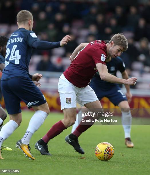 Sam Foley of Northampton Town attempts to control the ball under pressure from Jason Demetriou of Southend United during the Sky Bet League One match...
