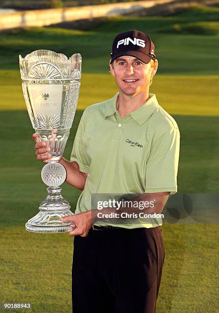 Heath Slocum poses with the tournament trophy after winning the The Barclays at Liberty National Golf Club on August 30, 2009 in Jersey City, New...