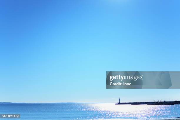 small lighthouse under clear blue sky - enoshima island stock pictures, royalty-free photos & images