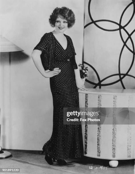 American actress Clara Bow wearing a spotted outfit, circa 1930.