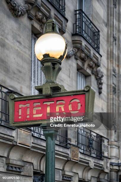 old metro sign in paris,france. - subway paris stock-fotos und bilder