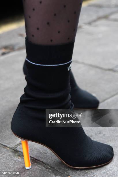 Woman is pictured outside the BFC Showspace as she wears the iconic 'Stretch-jersey ankle boots' by the controversial french brand Vetements, at the...