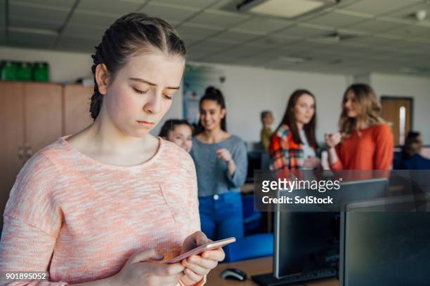 teenage girl being bullied by text message - exclusion stock pictures, royalty-free photos & images