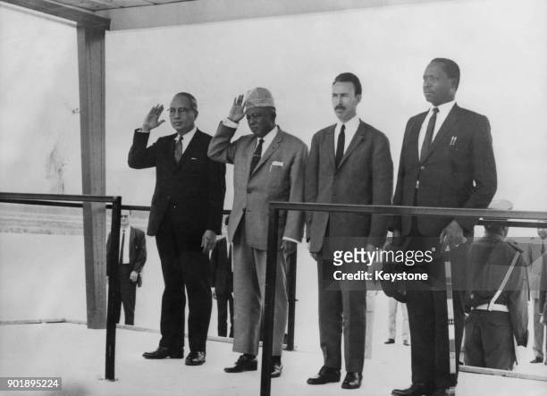 African heads of state salute a guard of honour of the Algerian Army at the airport in Algiers, Algeria, where they have met to discuss the situation...