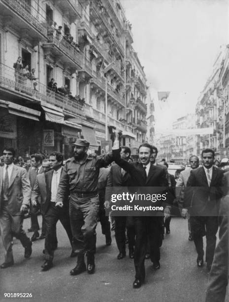 Colonel Houari Boumédiène , the Algerian leader , takes Cuban premier Fidel Castro on a tour of Algiers, Algeria, during an official visit, 15th May...