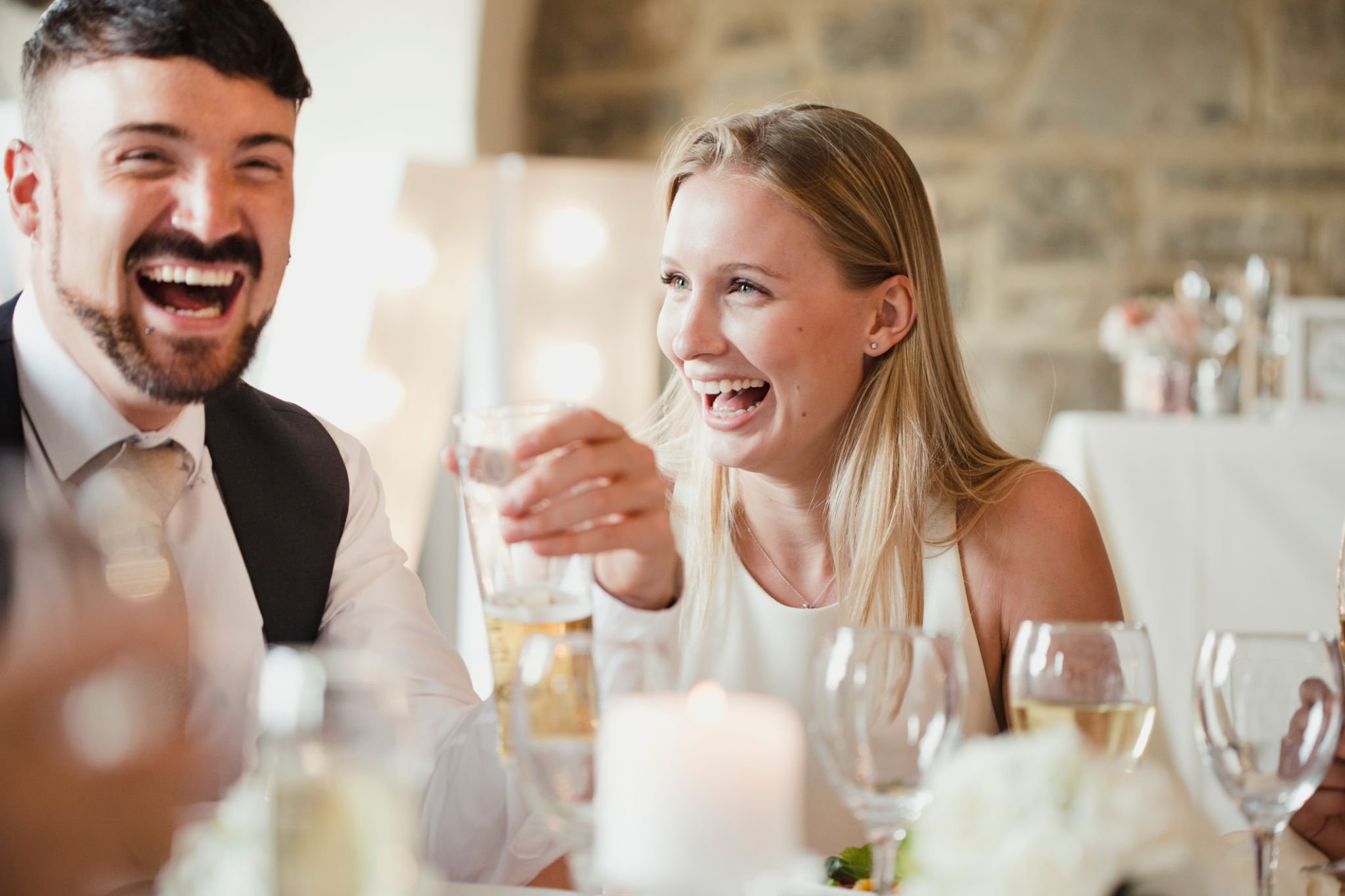wedding guests laughing