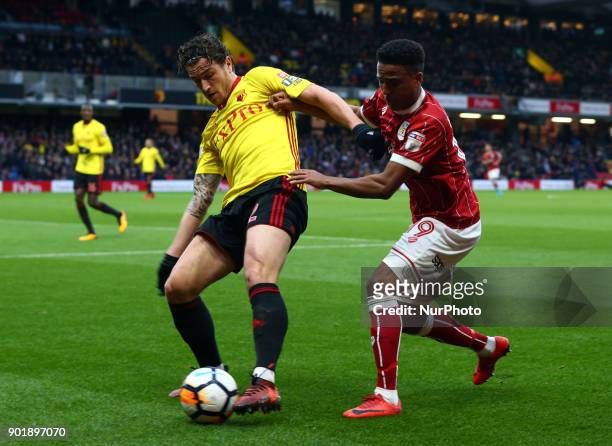 Watford's Daryl Janmaat holds of Bristol City's Niclas Eliasson during FA Cup 3rd Round match between Watford and Bristol City at Vicarage Road...