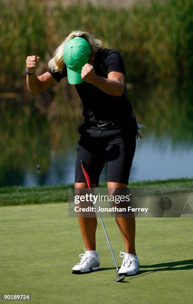 Suzann Pettersen reacts to making a par putt to get into playopff on the 18th hole during the final round of the Safeway Classic on August 30, 2009...