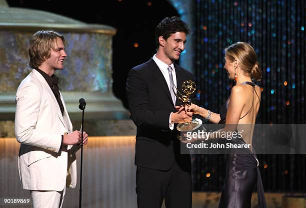 Actors Van Hansis and Jake Silbermann present actress Tamara Braun the Emmy for Outstanding Supporting Actress in a Drama Series during the 36th...