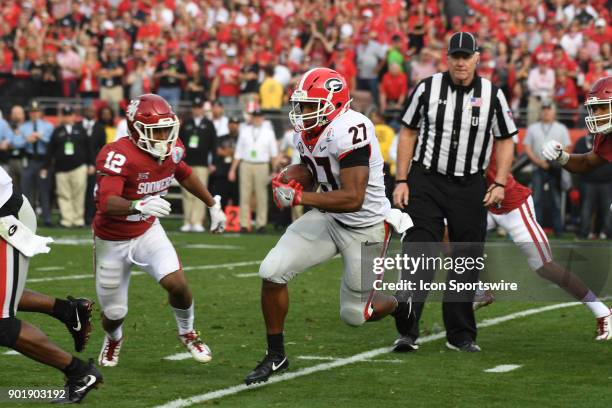 Nick Chubb of the Georgia Bulldogs runs the ball during the College Football Playoff Semifinal at the Rose Bowl Game between the Georgia Bulldogs and...