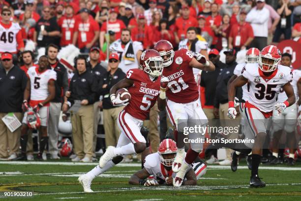 Marquise Brown of the Oklahoma Sooners with a long reception during the College Football Playoff Semifinal at the Rose Bowl Game between the Georgia...