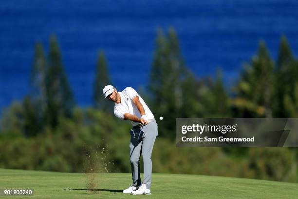 Dustin Johnson of the United States plays a shot on the fourth hole during the third round of the Sentry Tournament of Champions at Plantation Course...