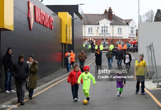 General view as young fans play football outside the stadium before the Emirates FA Cup Third Round match between Watford and Bristol City at...