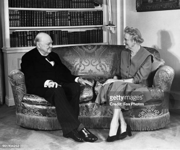 Former British Prime Minister Winston Churchill and Lady Churchill pose for his 82nd birthday portrait at their home in Hyde Park Gate, London, 30th...