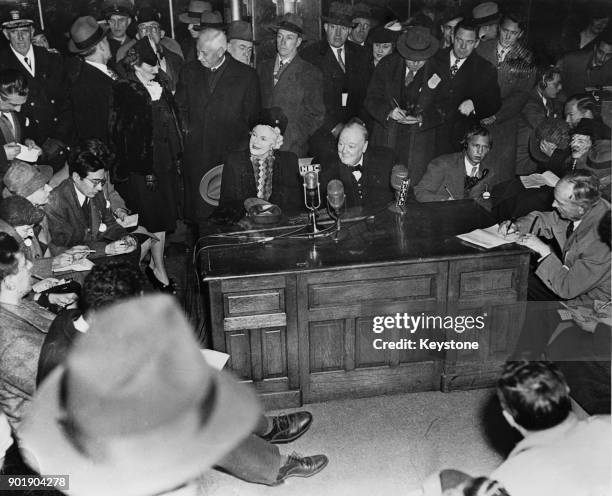 Former British Prime Minister Winston Churchill and Lady Churchill hold a press conference upon their arrival in the United States on the 'Queen...