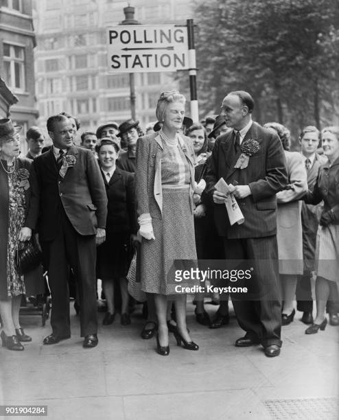 Clementine Churchill, the wife of British Prime Minister Winston Churchill, arrives at the polling station at Caxton Hall in London during the...