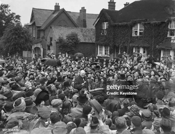 British Prime Minister Winston Churchill and Lady Churchill arrive in his constituency of Woodford, Essex, during his election campaign, 26th May...