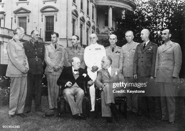 British Prime Minister Winston Churchill and US President Franklin D. Roosevelt pose on the lawn of the White House in Washington, DC, before a...