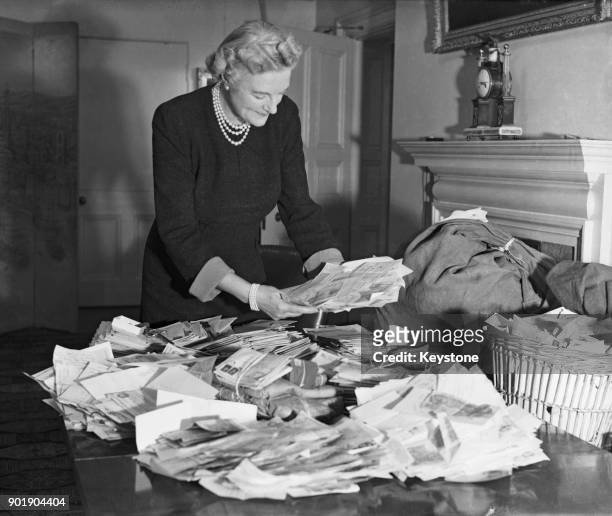 Clementine Churchill, the wife of British Prime Minister Winston Churchill, deals with letters in response to her appeal on behalf of the Red Cross...