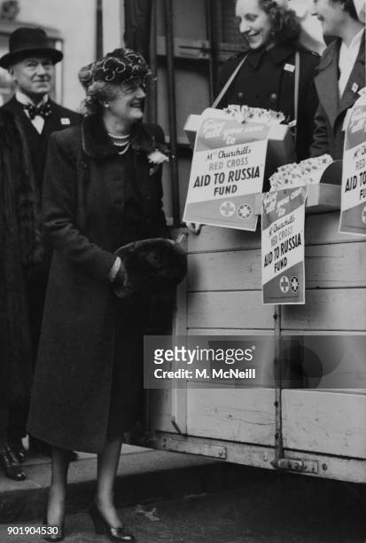 Clementine Churchill , the wife of Prime Minister Winston Churchill, visits the Aid for Russia depot at Derry & Toms in Kensington, London, and chats...