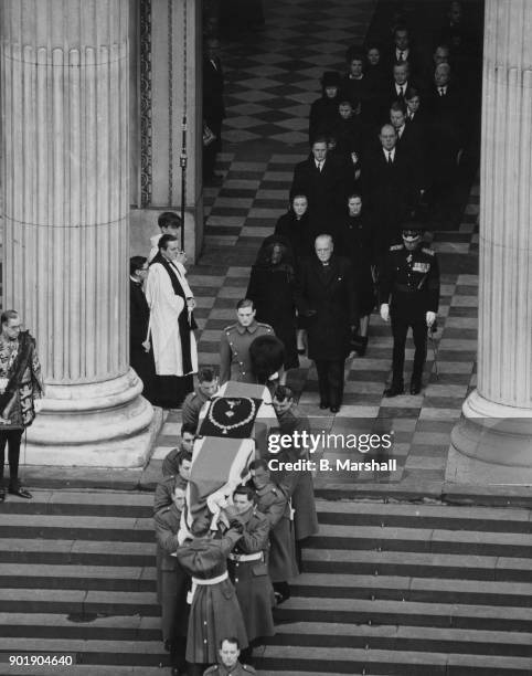 The coffin of former British Prime Minister Winston Churchill is carried out of St Paul's Cathedral after the funeral service, London, 30th January...