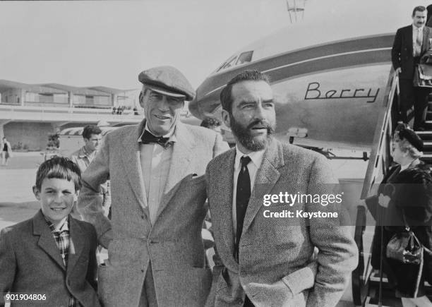 American film director John Huston and actor Montgomery Clift arrive at Vienna airport, Austria, for the filming of 'Freud: The Secret Passion', in...