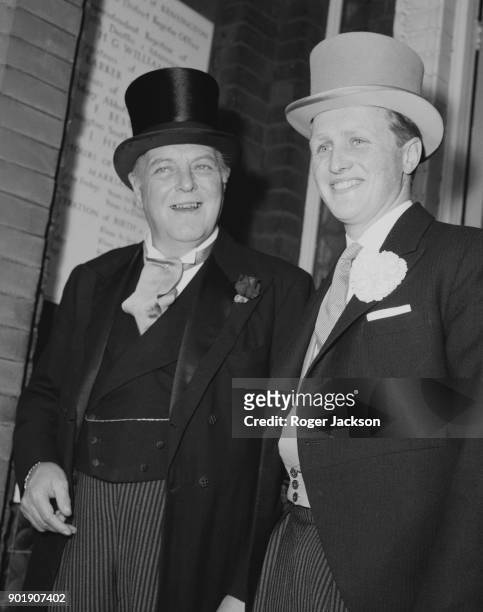Randolph Churchill , the son of former Prime Minister Winston Churchill, with his son Winston Jr. During the latter's wedding to Minnie d'Erlanger at...