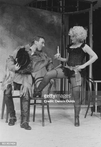 Actors Diane Cilento as Rosario and Michael Deacon as Franklin Muldoon in a scene from the play 'The Artful Widow' by Carlo Goldoni, during dress...