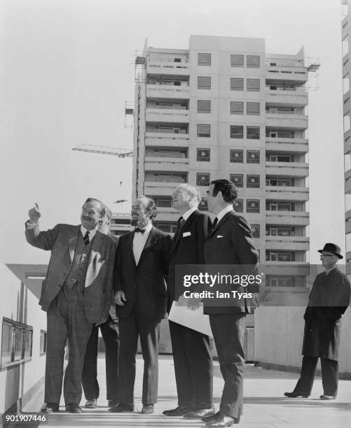 The first of four completed blocks of flats at Thamesmead in London is officially handed over to the Greater London Council by the main contractors,...